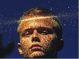 Portrait with golden light pattern across the face